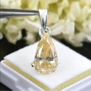 3.25 karats champagne Diamond solitaire pendant in pear shape.